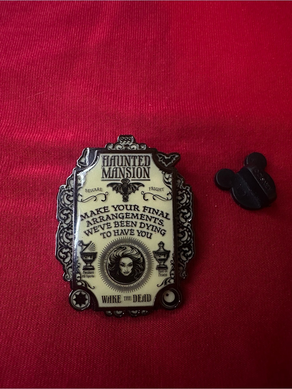 Disney Black Enamel Pin Backing on Red Fabric